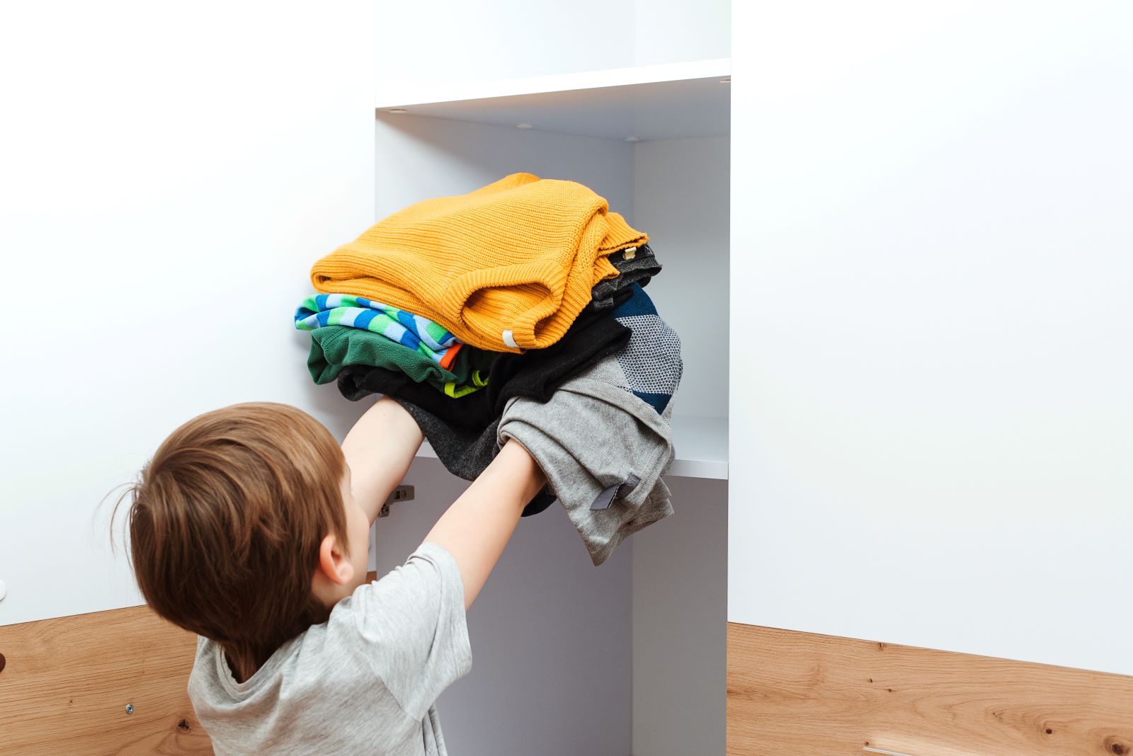 Kid Reaching Clothes