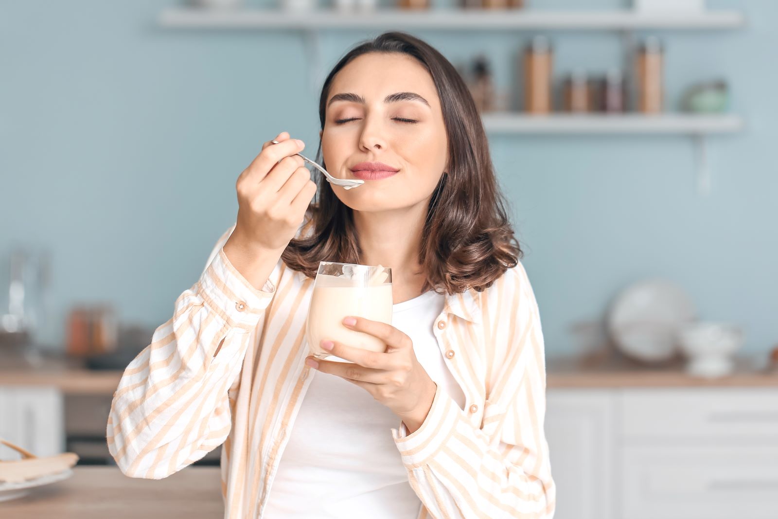 Woman Eating Yoghurt